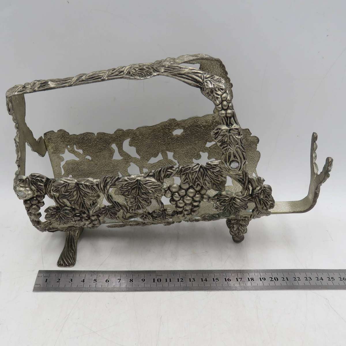 Vintage silverplated vintner motif wine bottle stand