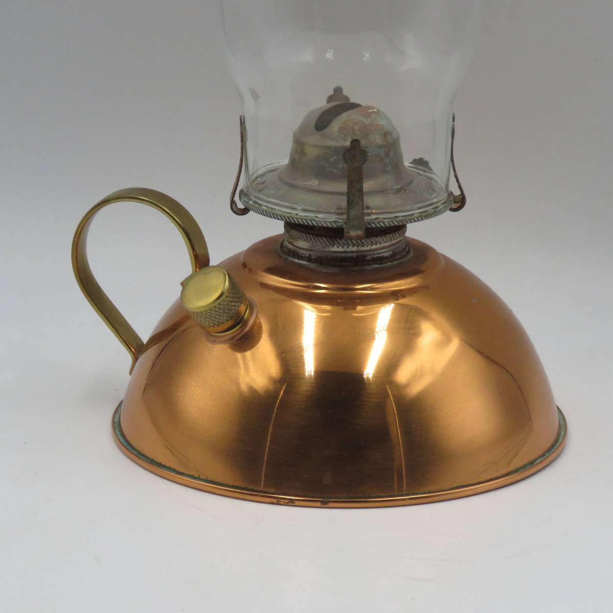Vintage copper oil lantern with brass handle and glass chimney