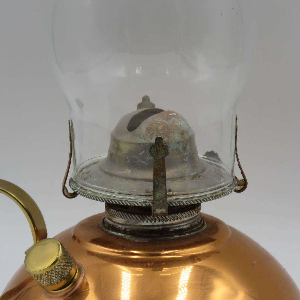 Vintage copper oil lantern with brass handle and glass chimney