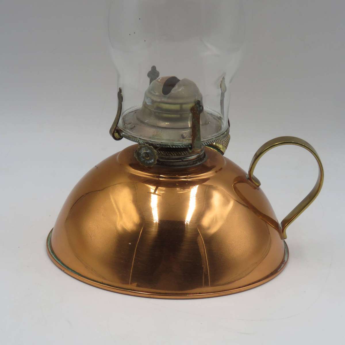 Vintage copper oil lantern with brass handle and glass chimney