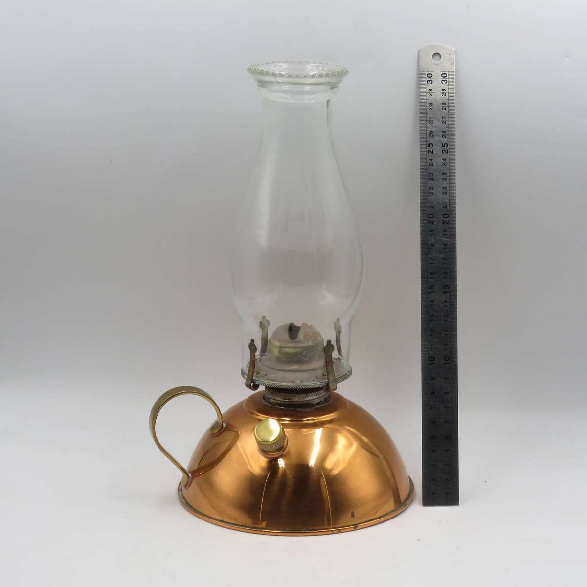 Vintage copper oil lantern with brass handle and glass chimney