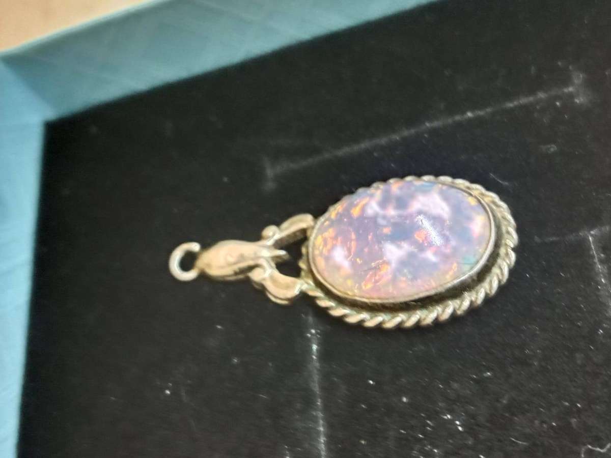 Vintage Ovel Opal Pendant set on a silver frame