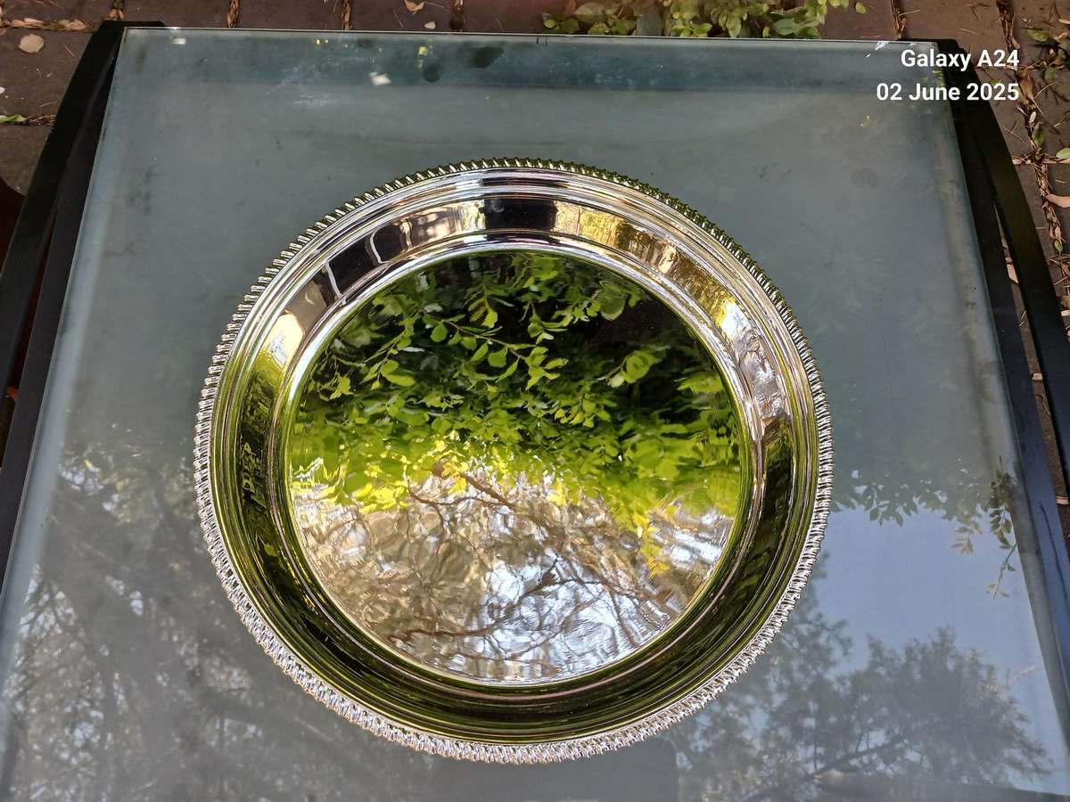Round silver plated tray.