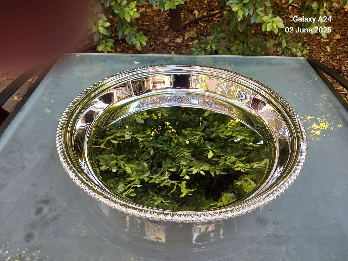 Round silver plated tray.