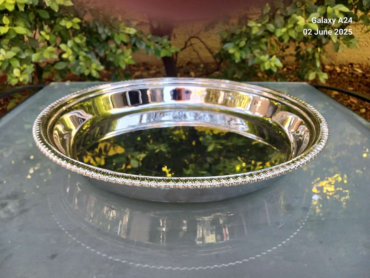 Round silver plated tray.