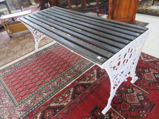 Wrought iron and wood slatted garden bench