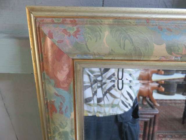 Large floral framed bevelled mirror