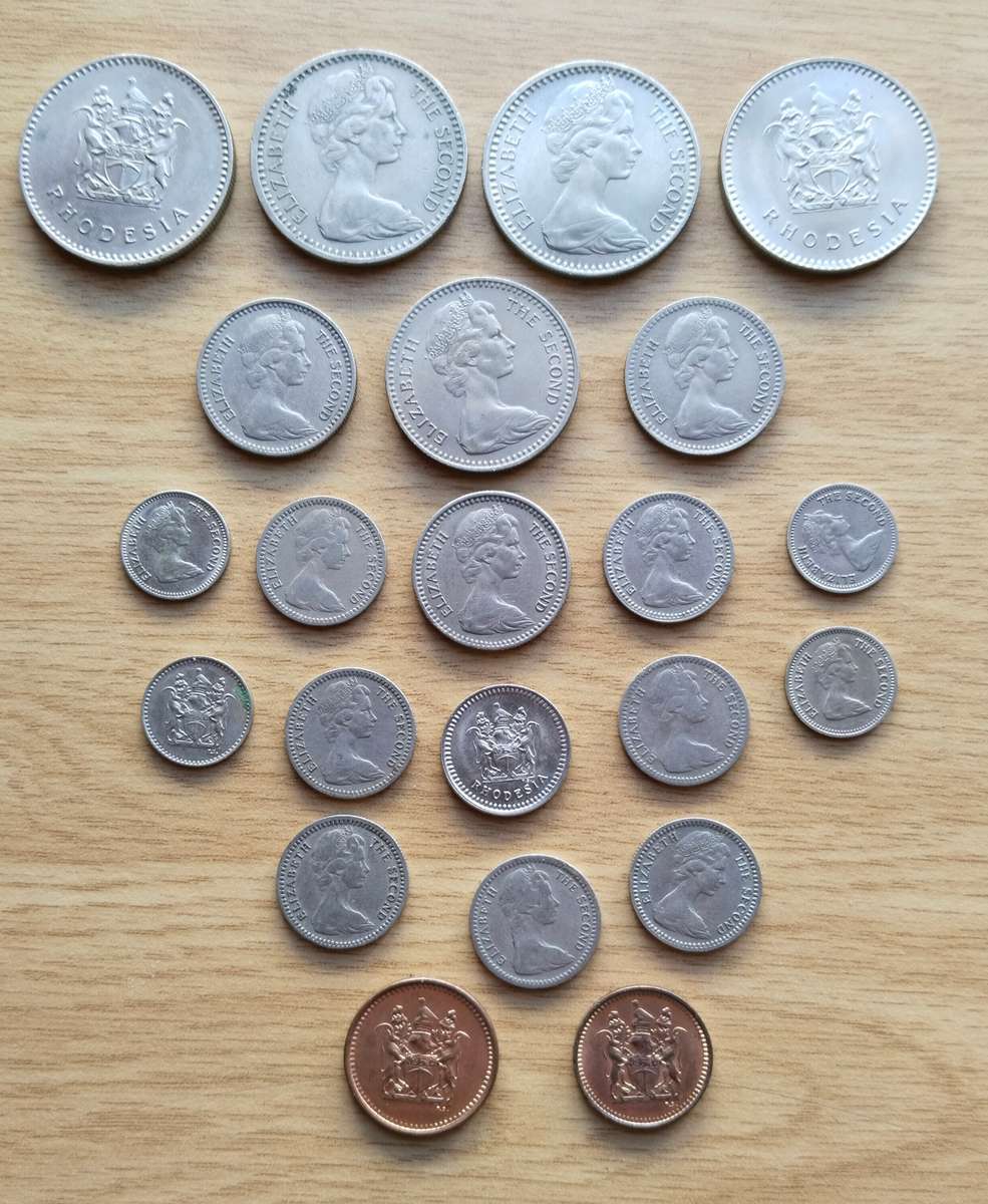 Rhodesia collection of 23 old coins. Some Good. (5 cents seems to be struck off centre)