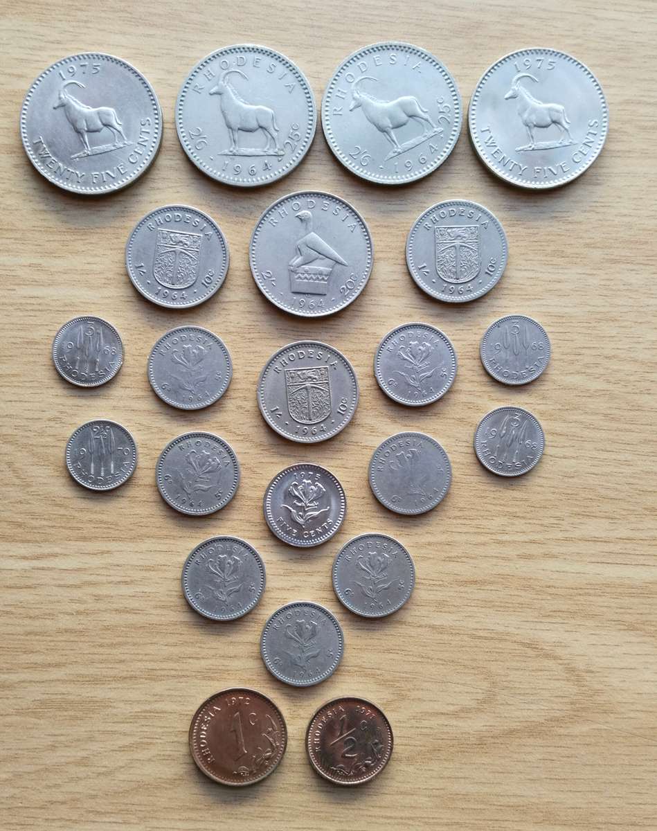 Rhodesia collection of 23 old coins. Some Good. (5 cents seems to be struck off centre)
