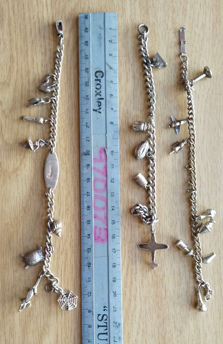 Collection of charm bracelets, necklace and watch.