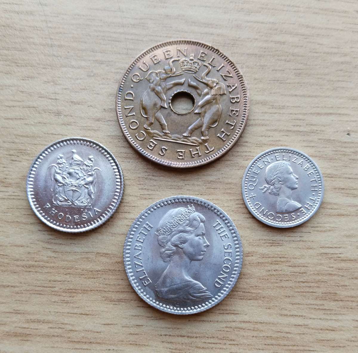 Collection of 4 UNC Rhodesia coins.