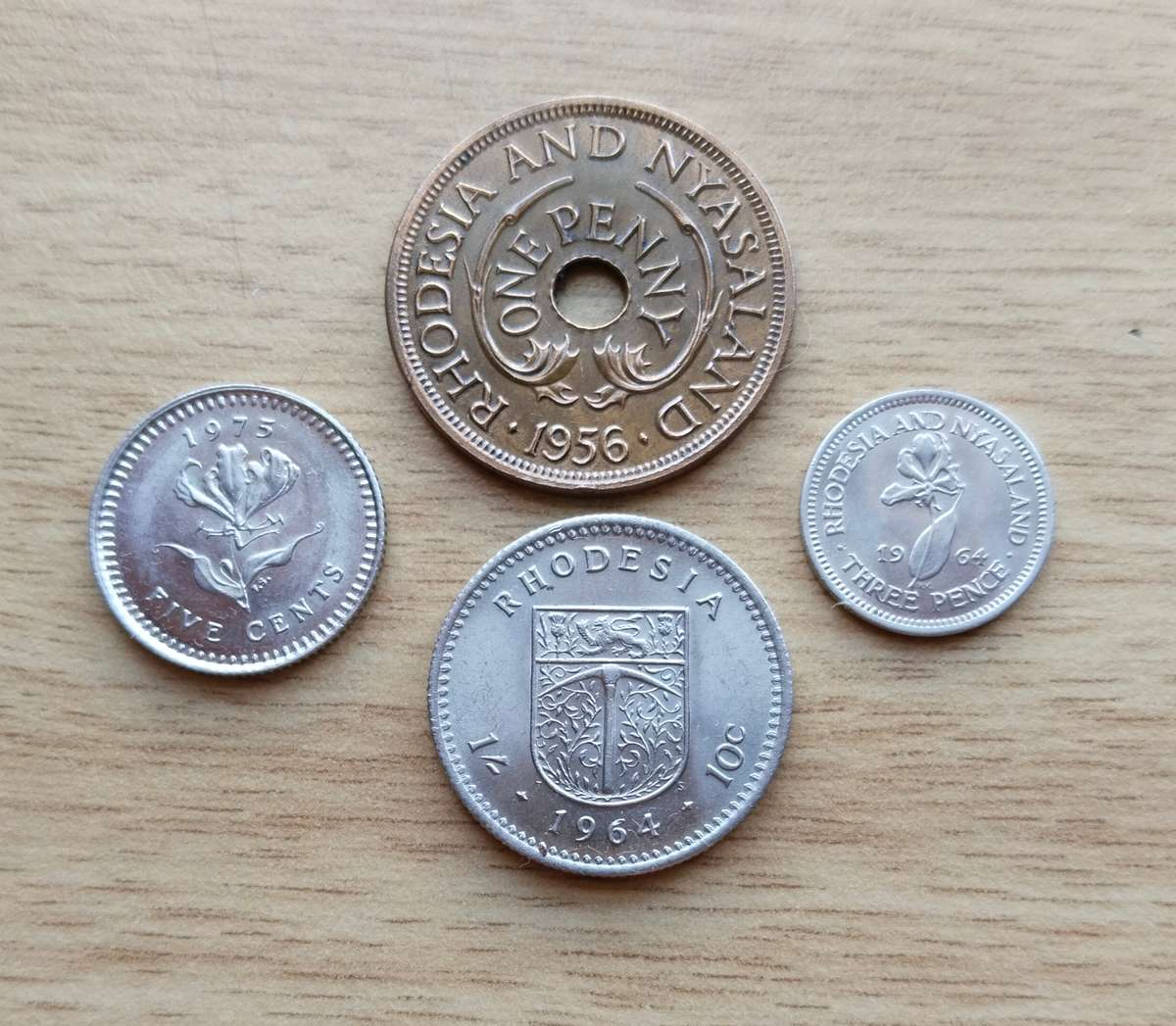 Collection of 4 UNC Rhodesia coins.