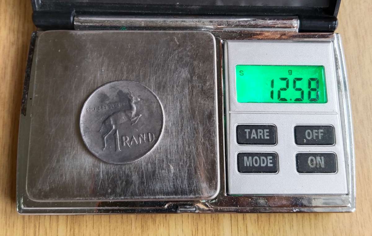 Error 1978 South Africa one rand. Looks like lead.
