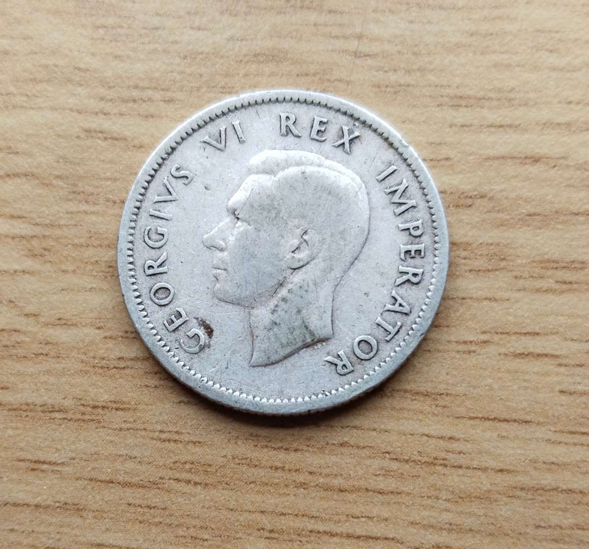 Error 1942 Silver South Africa Shilling.