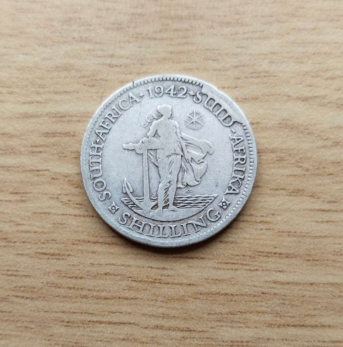 Error 1942 Silver South Africa Shilling.