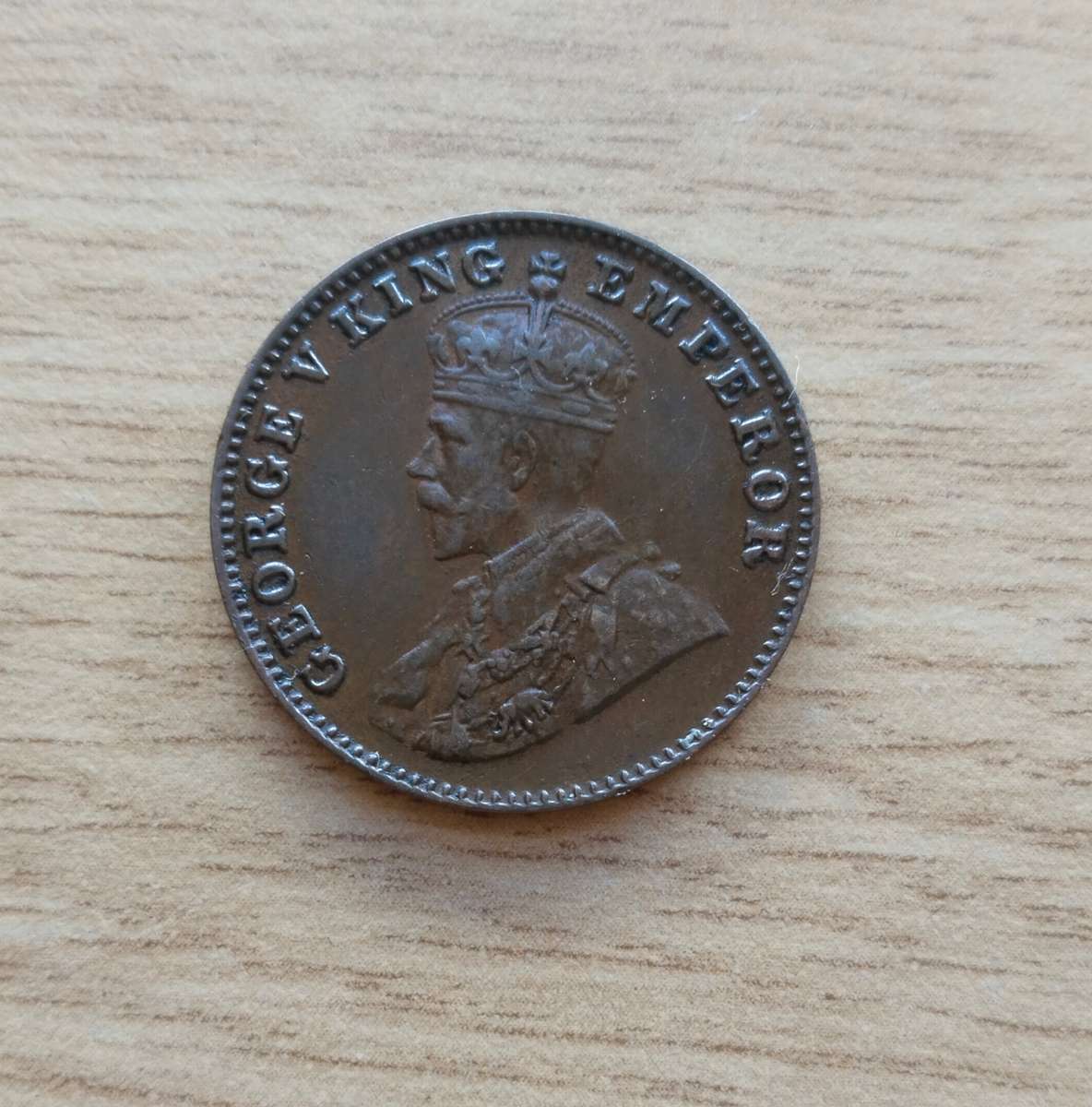 India 1928 One Quarter Anna. Good condition.