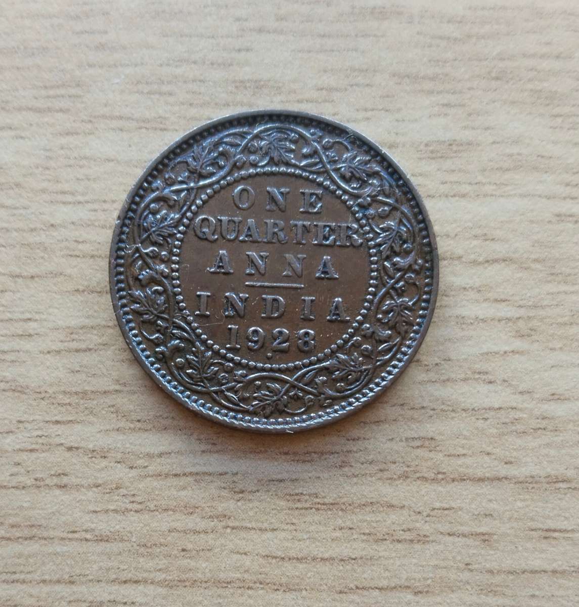 India 1928 One Quarter Anna. Good condition.