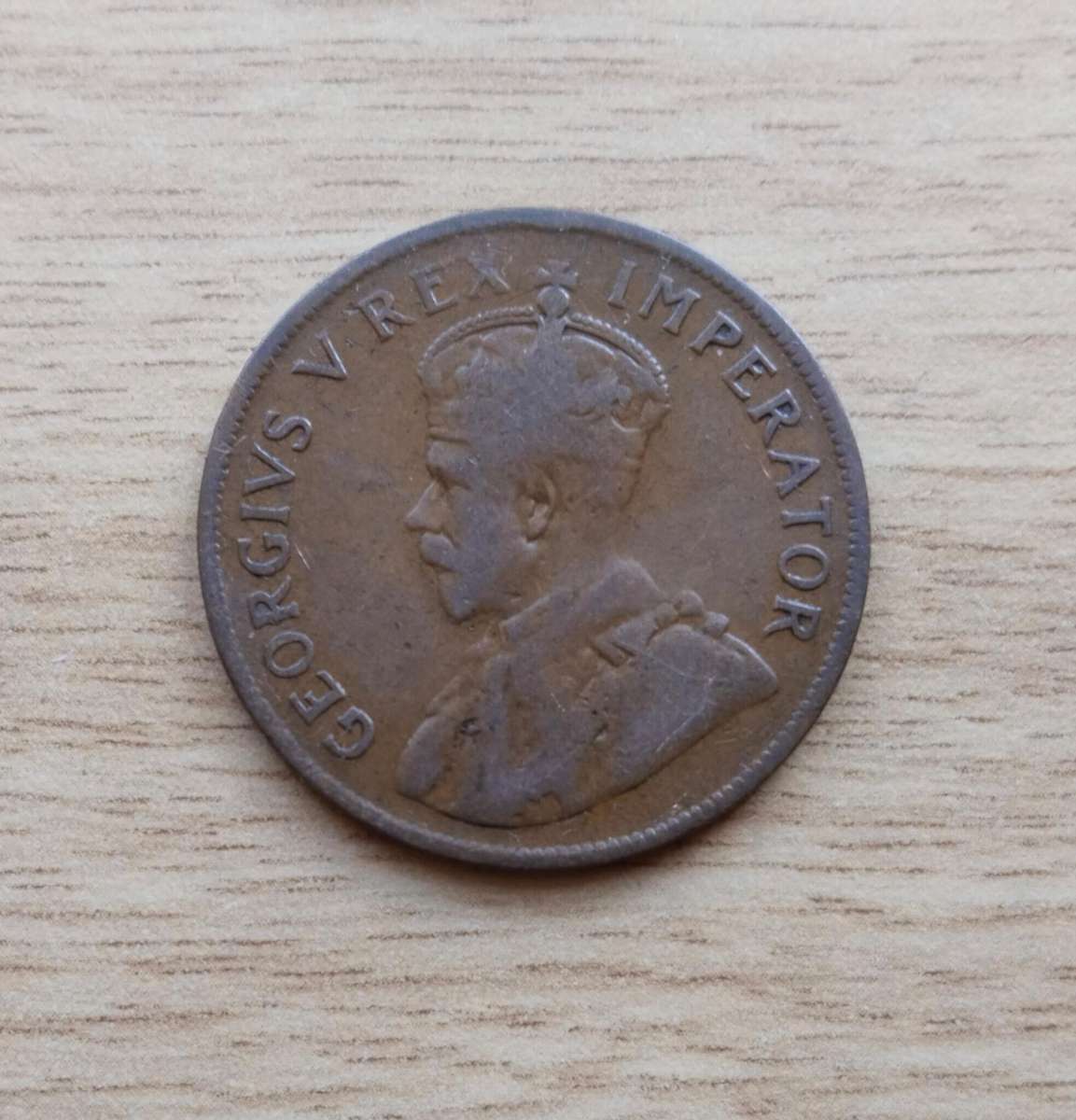 Error South Africa 1923 Penny. Faint letters.