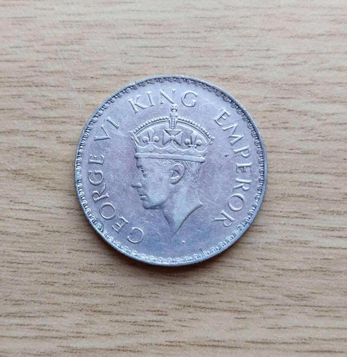 India 1938 Silver One Rupee. Good Condition. 11.62 Grams.  91.7% Silver.