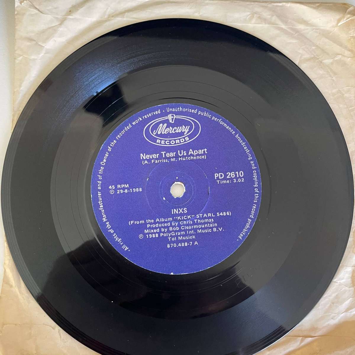INXS-7 Inch Single- NEVER TEAR US APART/GUNS IN THE SKY(KICK ASS RE-MIX)