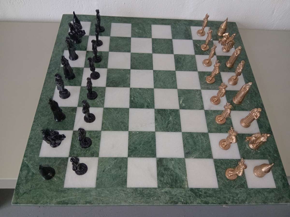 Italian marble chess board with metal medieval pieces. Beautiful.