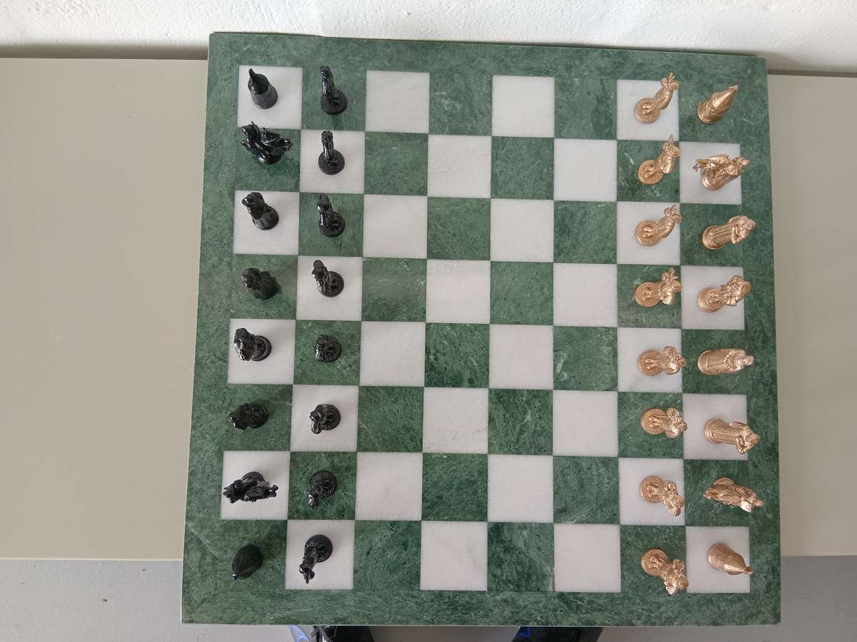 Italian marble chess board with metal medieval pieces. Beautiful.