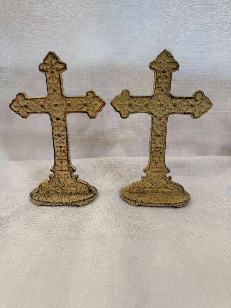 Two small metal crosses