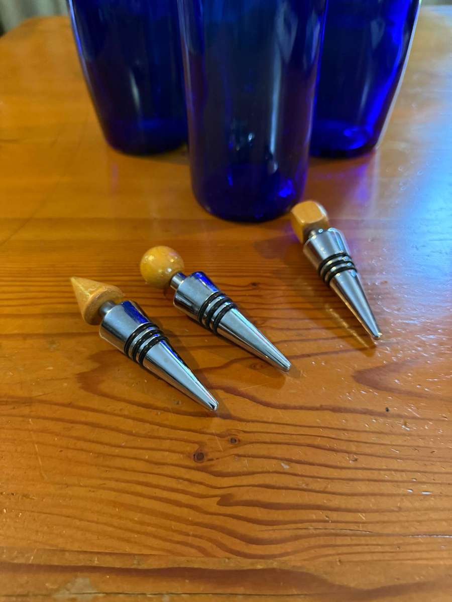 THREE BLUE BOTTLES
