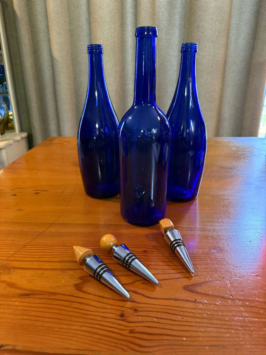THREE BLUE BOTTLES