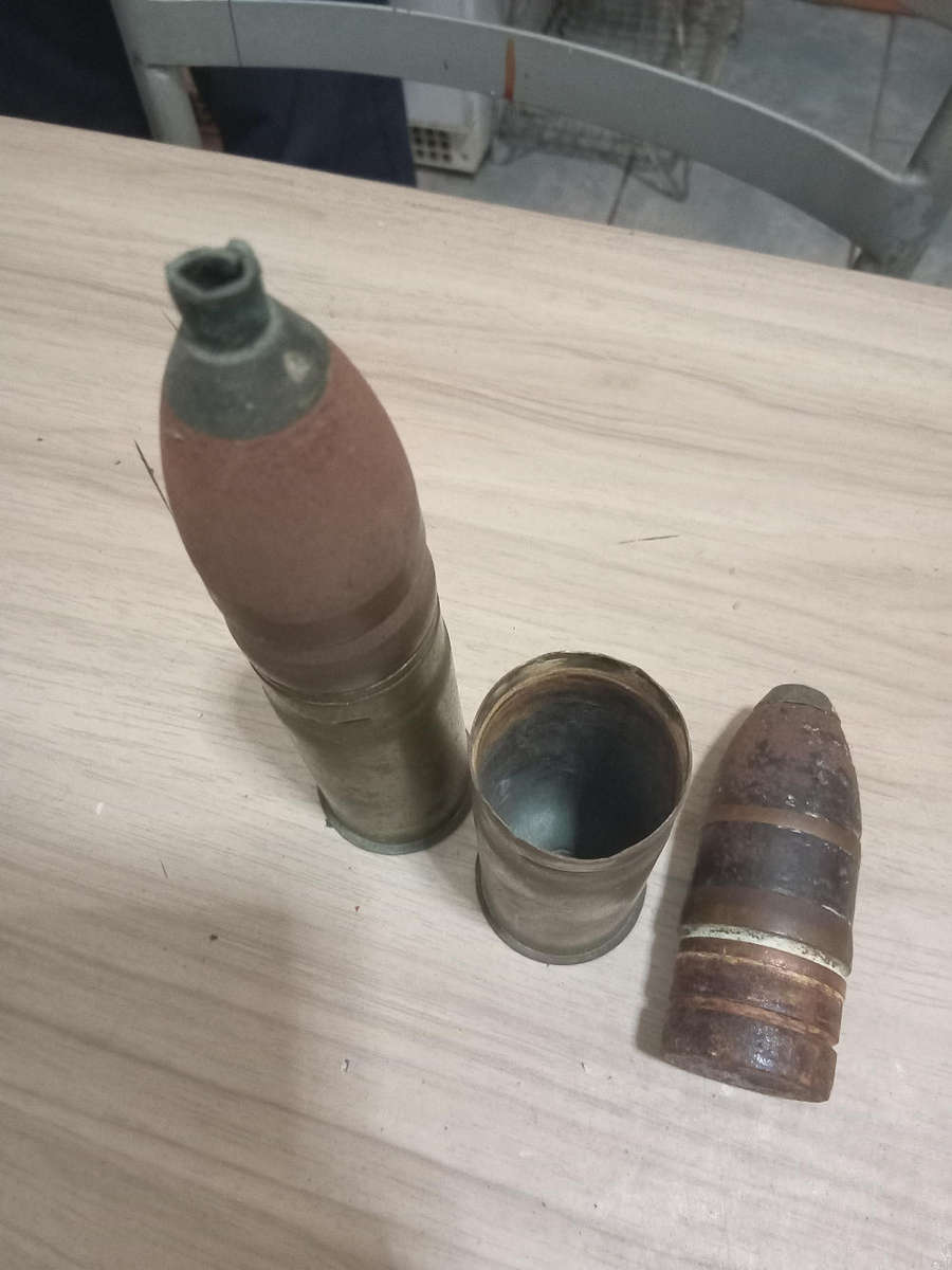 Two used German brass souvenir war bullets with projectile heads