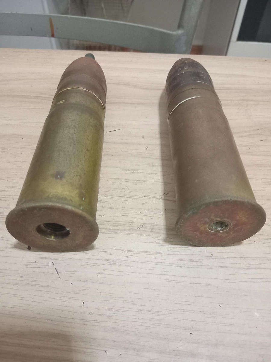 Two used German brass souvenir war bullets with projectile heads