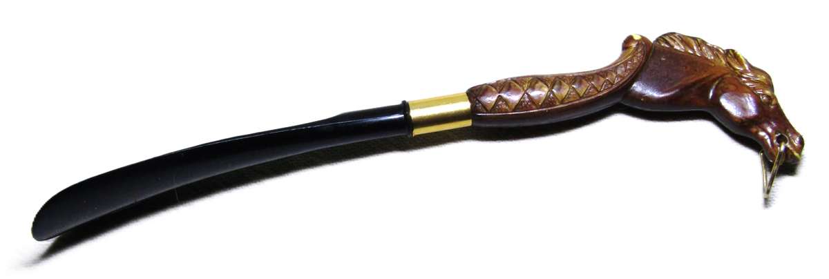 Vintage early plastic horse head shoe horn