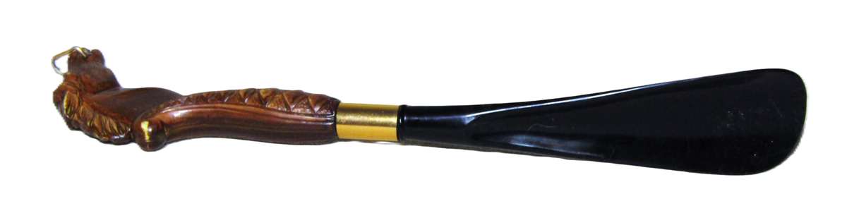 Vintage early plastic horse head shoe horn