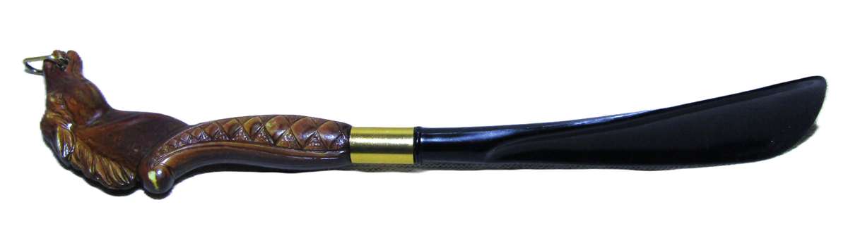 Vintage early plastic horse head shoe horn