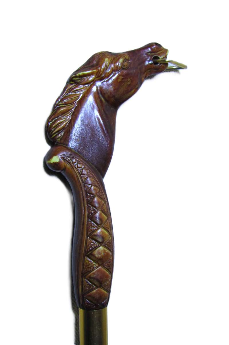 Vintage early plastic horse head shoe horn