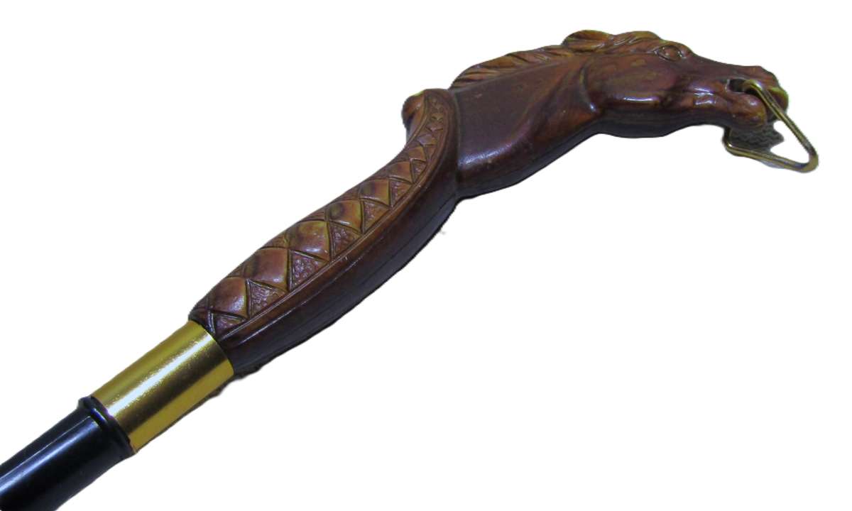 Vintage early plastic horse head shoe horn