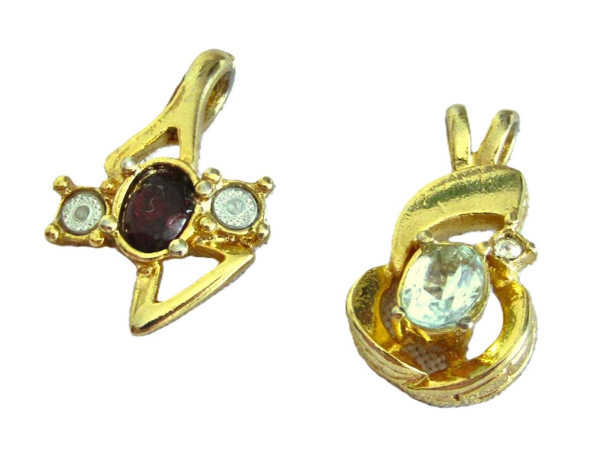 Pair of vintage gold tone 1970s style pendants with faceted crystal