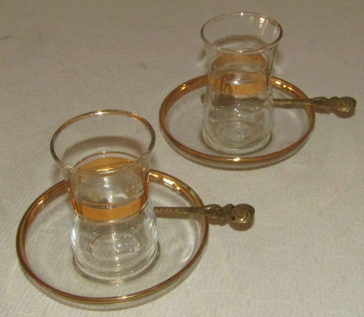 Pair of Vintage Pasabahce Istanbul Turkey Gold Trimmed Tea Cups with Saucers and Gilt Spoons