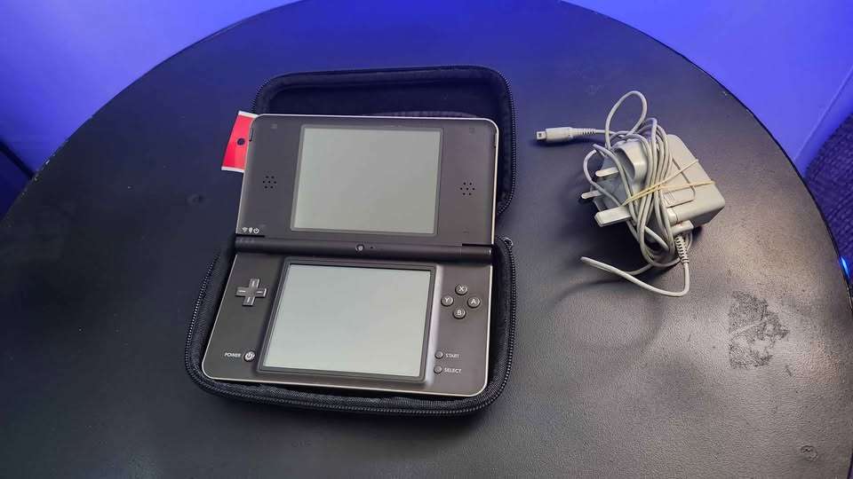 Nintendo DSi XL handheld console with accessories and pouch - Bronze