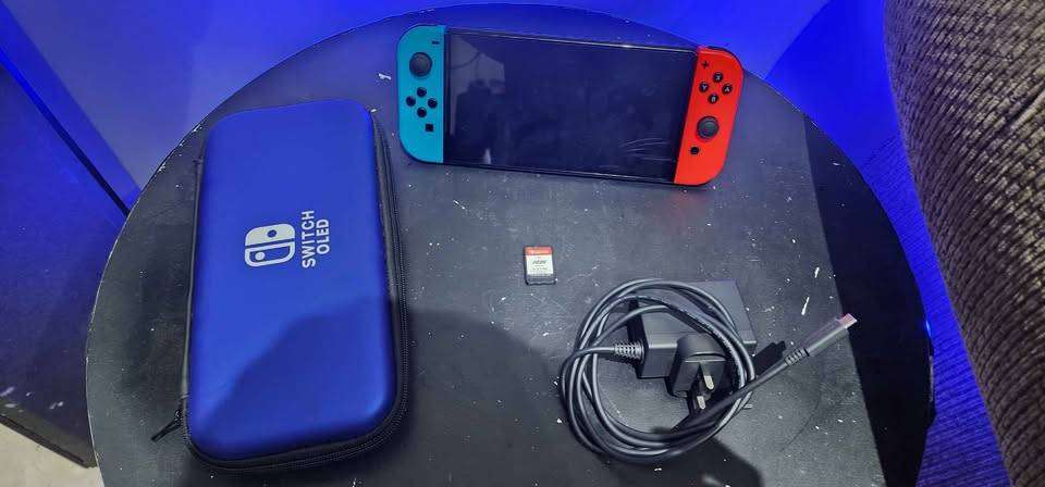 Nintendo Switch Console OLED with Fifa 25 + pouch - Red and Blue