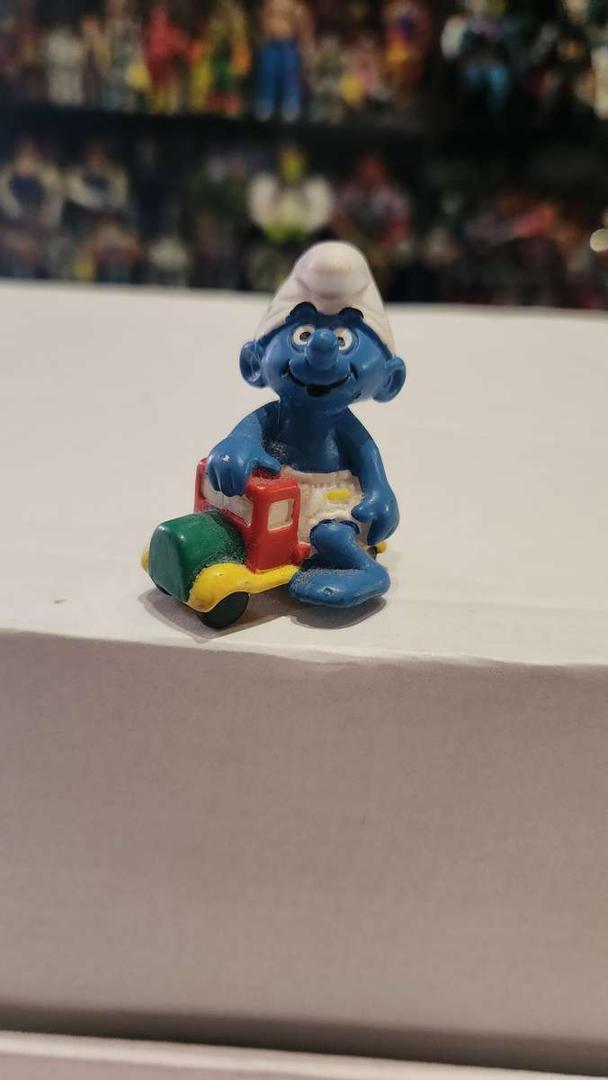 1996 Vintage Peyo Baby Smurf Riding Car