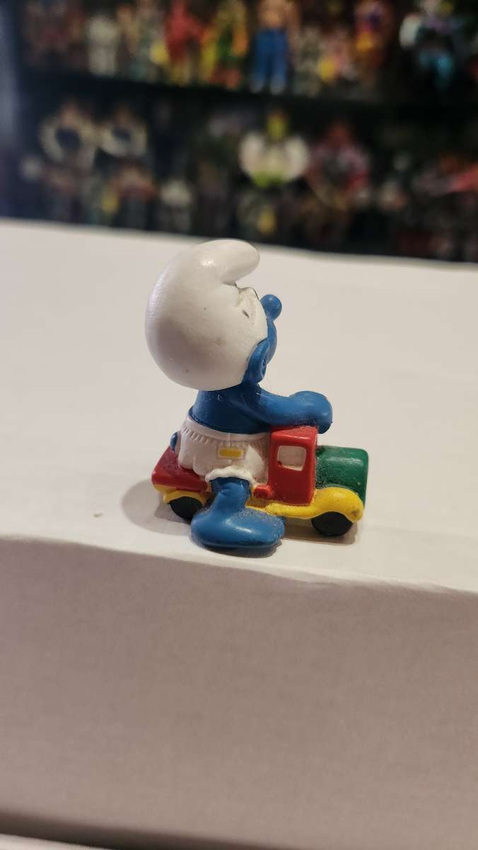 1996 Vintage Peyo Baby Smurf Riding Car