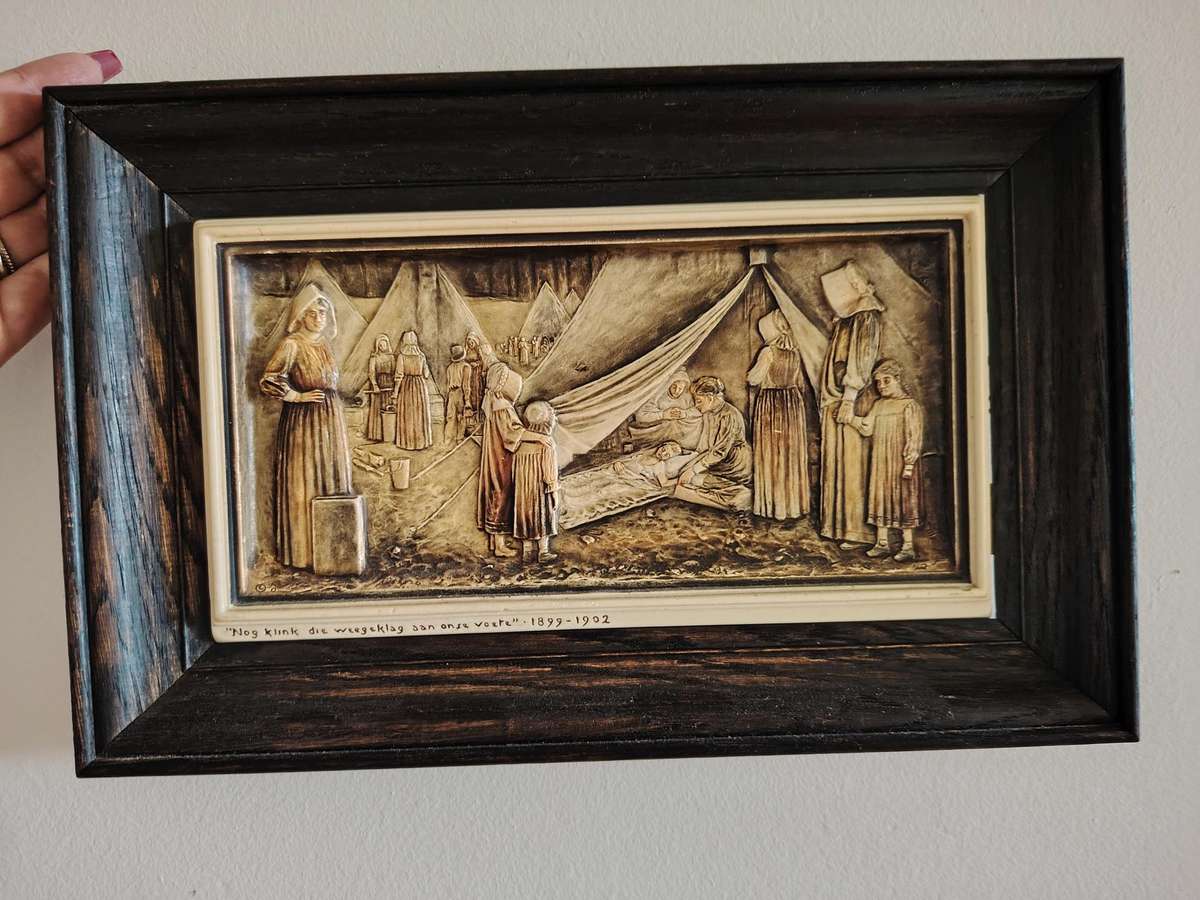 Carved Voortrekker remembrance wall hangings