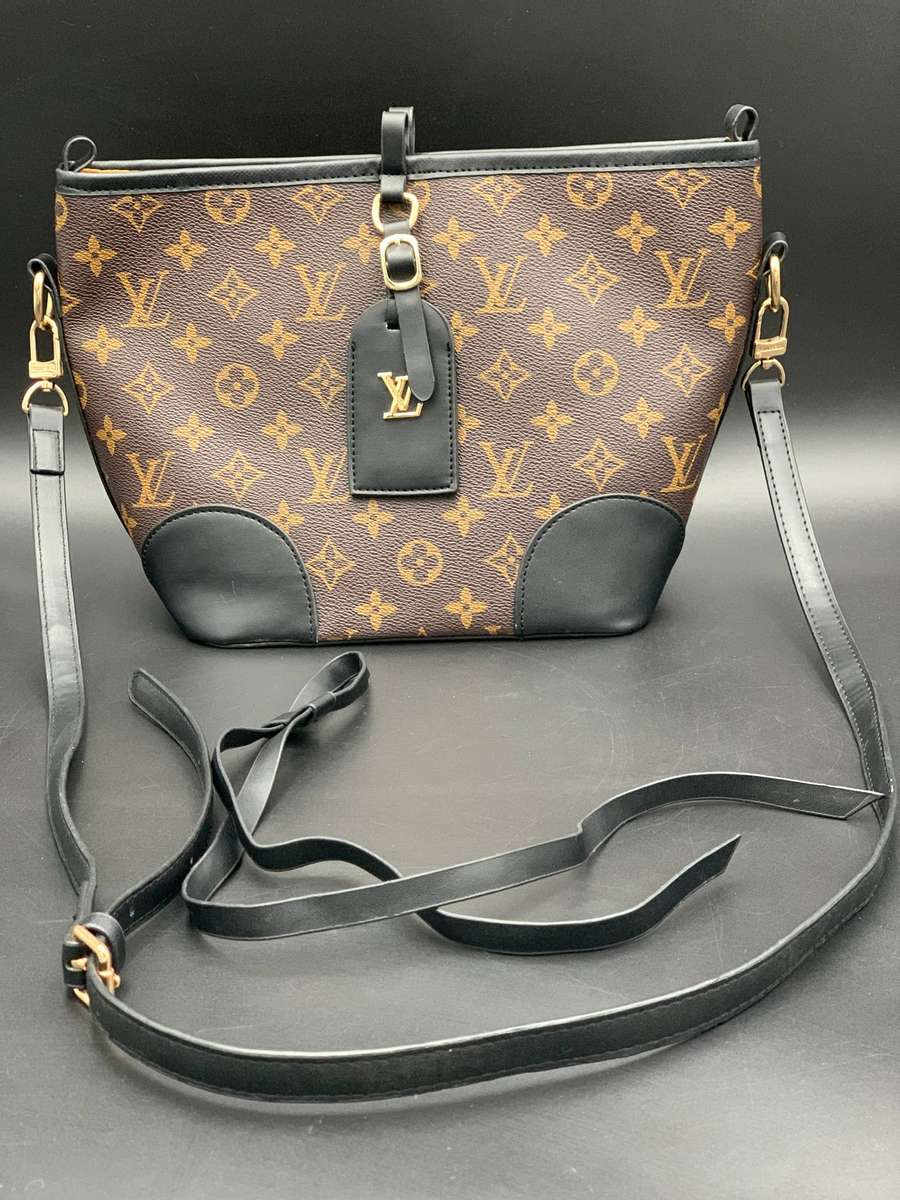 Designer Handbag in Monogram Canvas with black leather trim