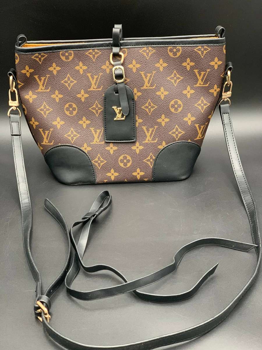 Designer Handbag in Monogram Canvas with black leather trim