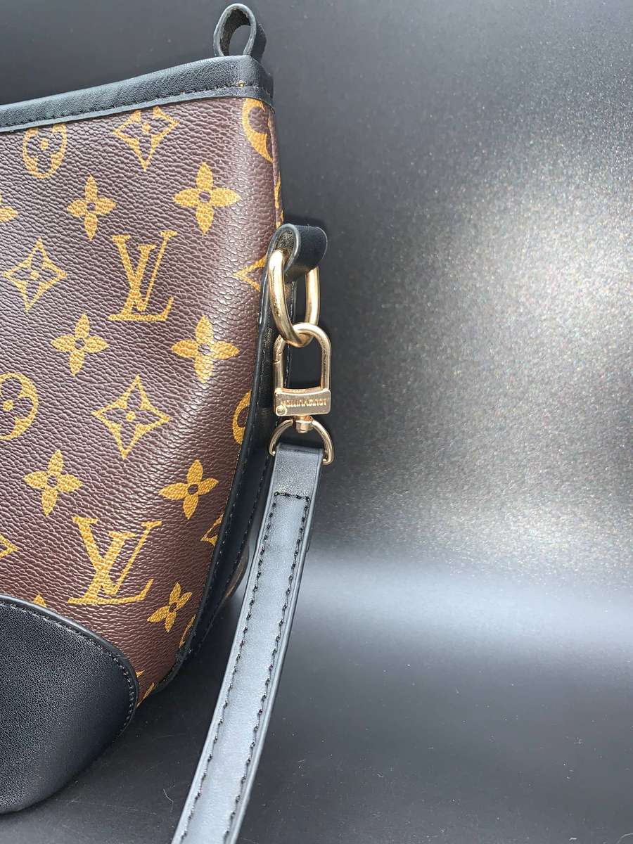 Designer Handbag in Monogram Canvas with black leather trim