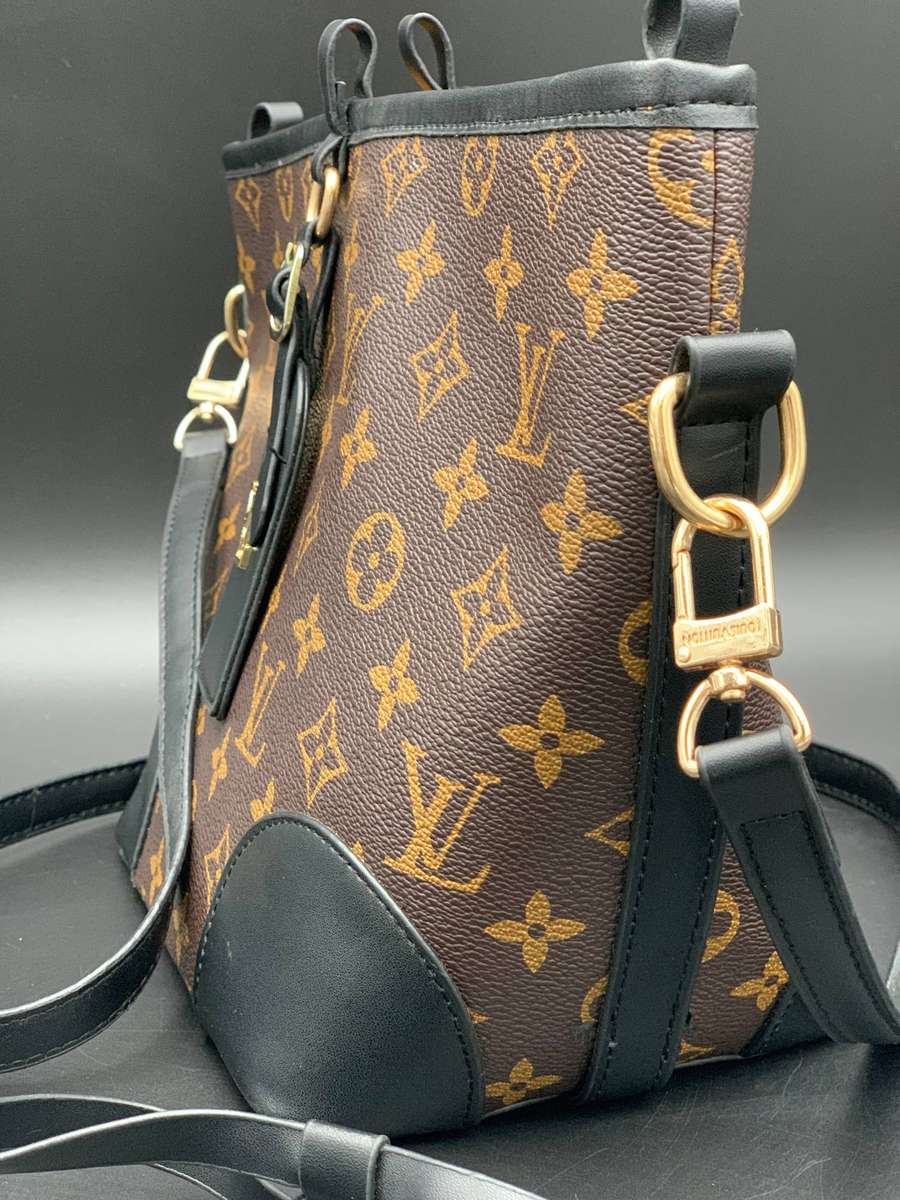 Designer Handbag in Monogram Canvas with black leather trim