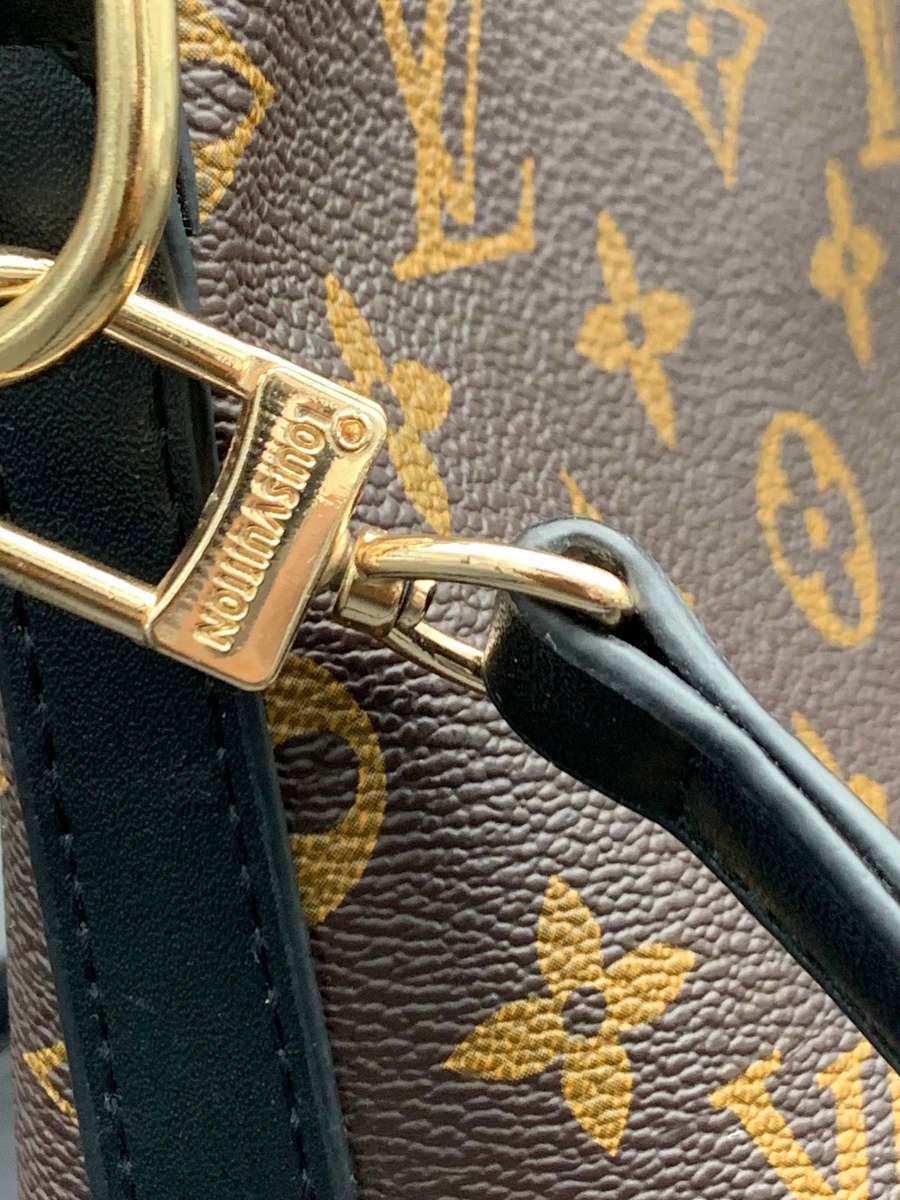 Designer Handbag in Monogram Canvas with black leather trim
