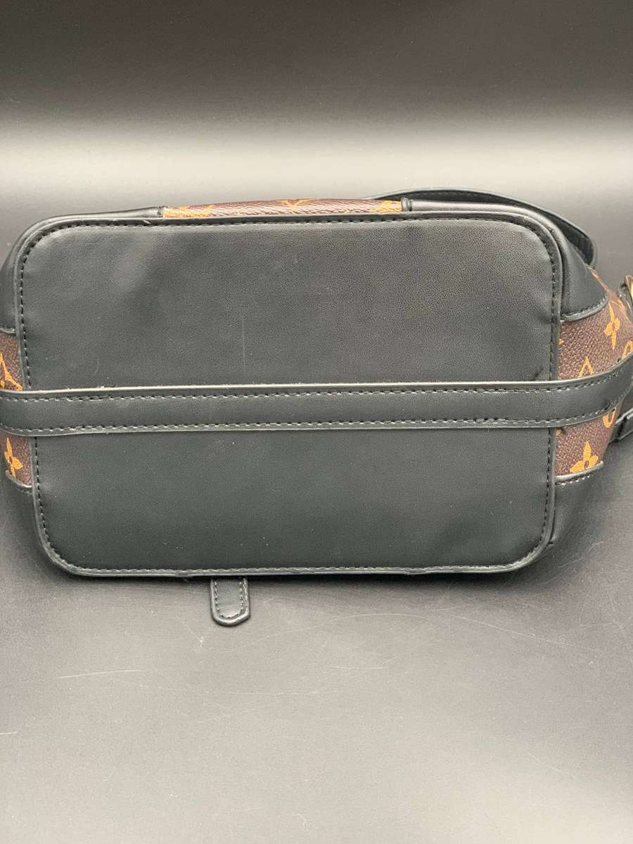 Designer Handbag in Monogram Canvas with black leather trim
