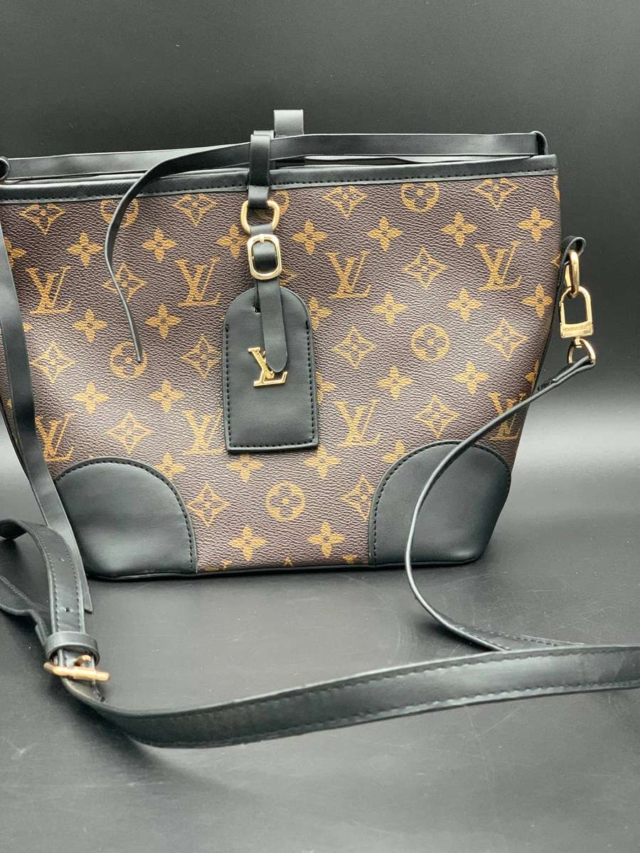 Designer Handbag in Monogram Canvas with black leather trim